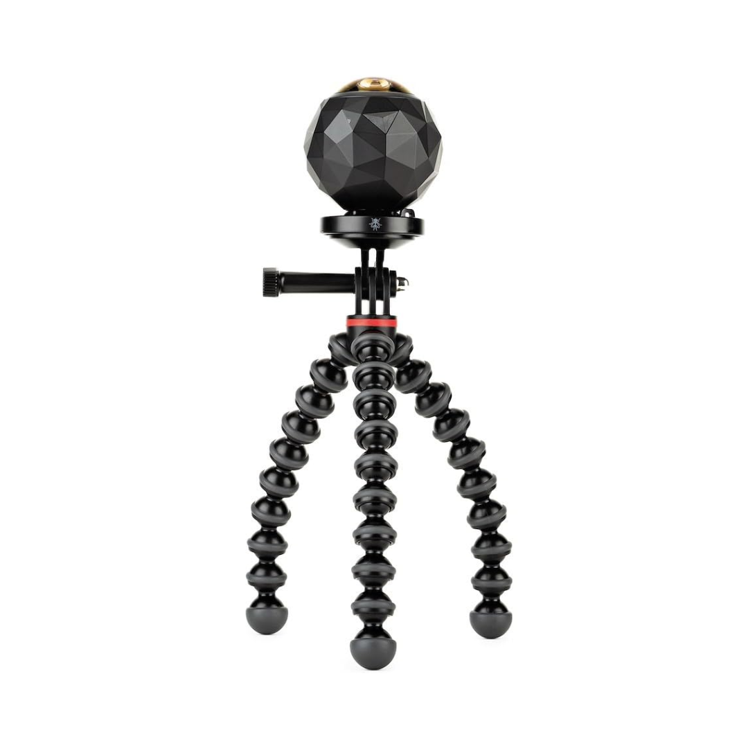 Joby GorillaPod 500 Action tripod holding a camera, flexible legs on table