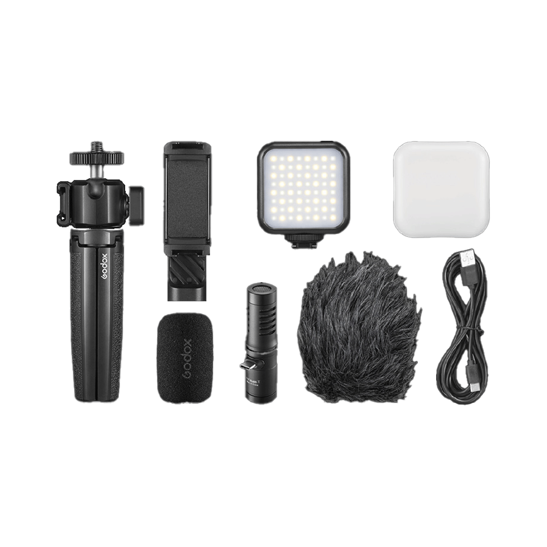 Unboxed Godox VK2-UC Vlogging Kit featuring compact microphone, tripod, and mobile accessories designed for vloggers and content creators.