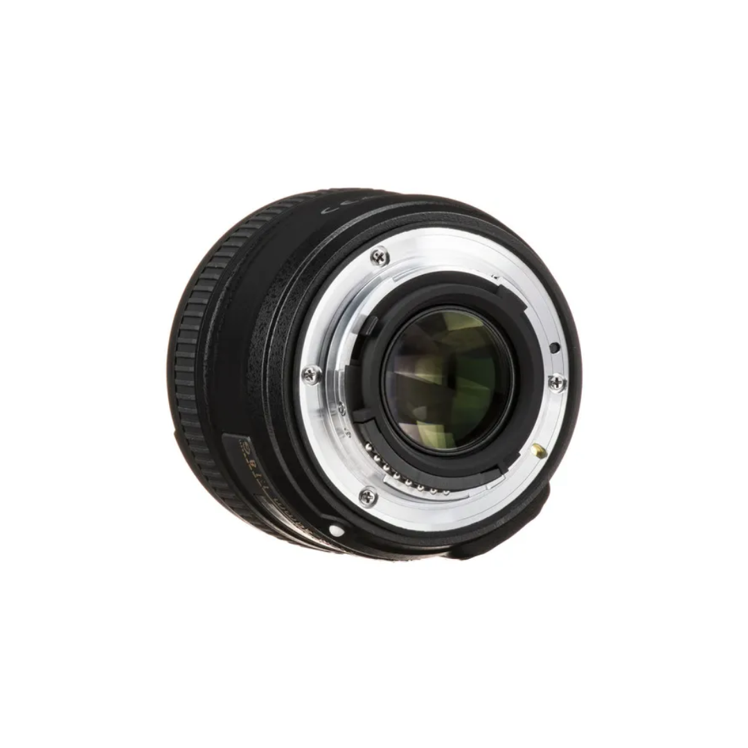 Unboxed Nikon AF-S 50mm f/1.8G prime lens with wide f/1.8 aperture for portrait and low-light photography.